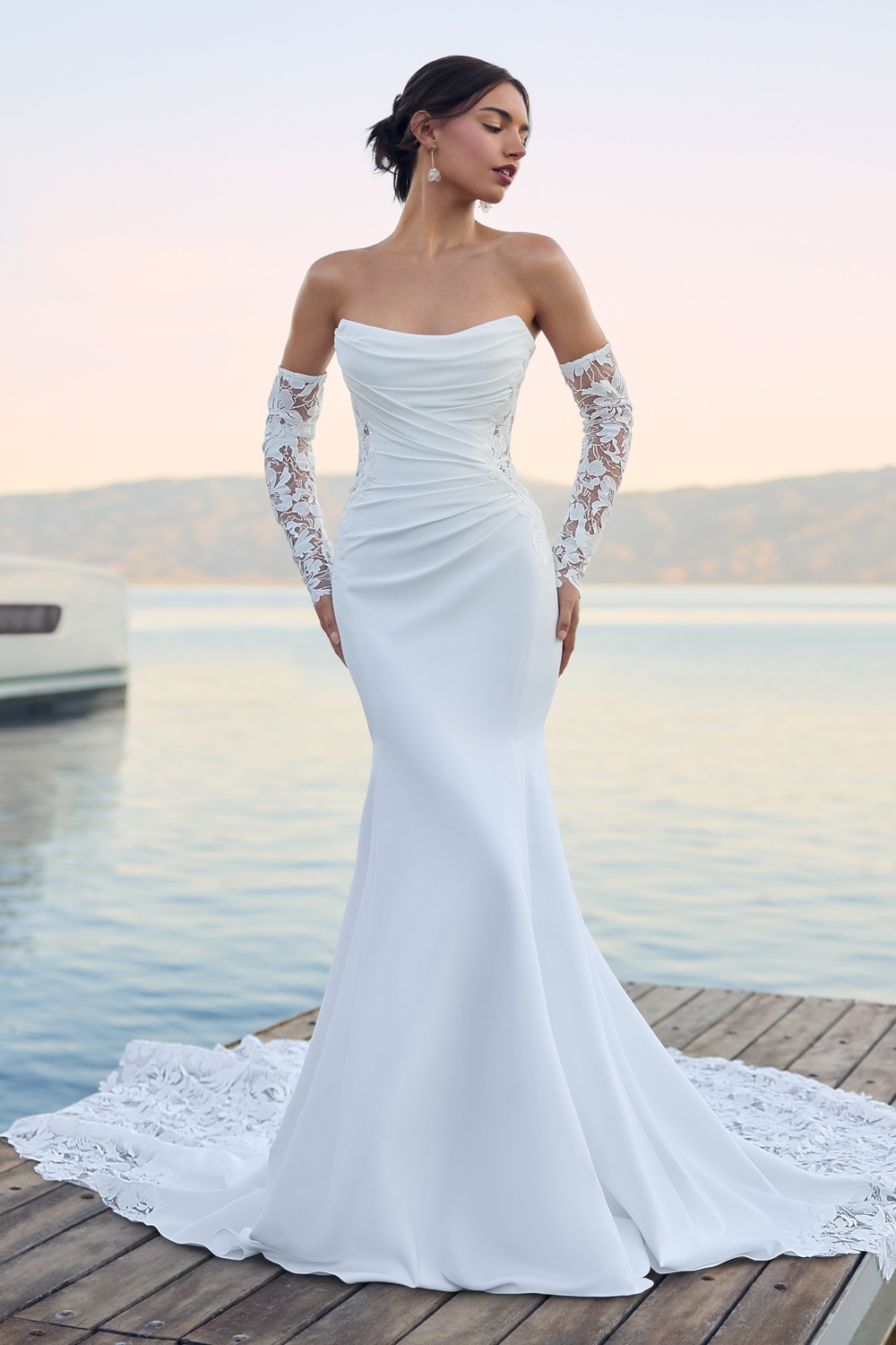 Ivory strapless crepe fit-and-flare wedding dress with lace train