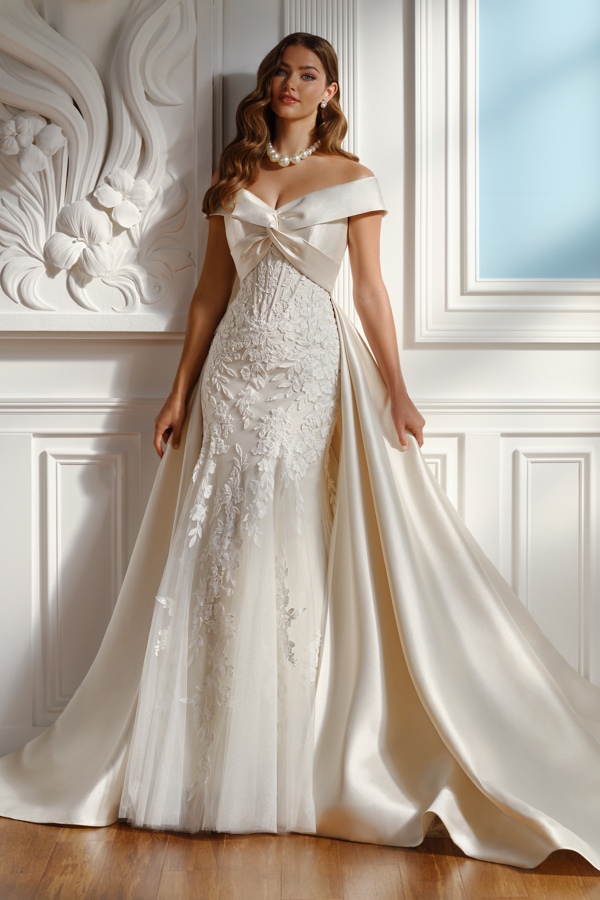 Wedding gown with an off-the-shoulder draped bodice and lace skirt